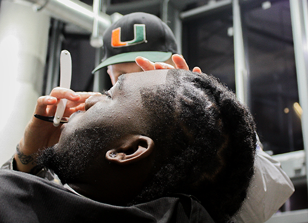 A student getting his hair cut