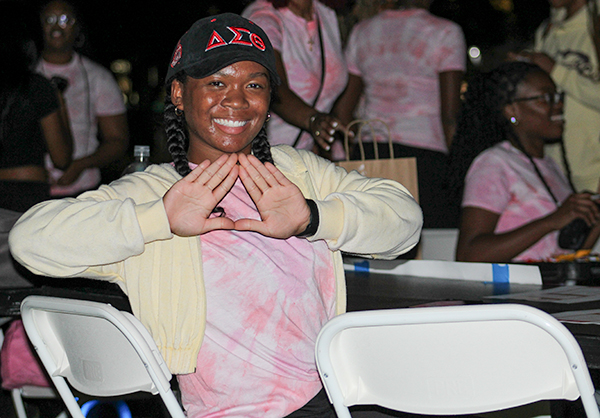 A student tabling at the Color Me Pink tabling event at the University of Miami