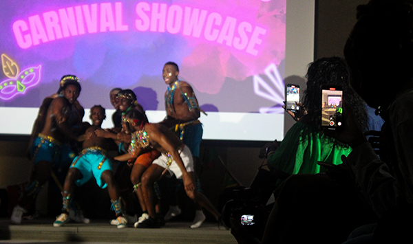 Audience members taking pictures at the Annual Carribean Students Association Carnival Showcase at the University of Miami