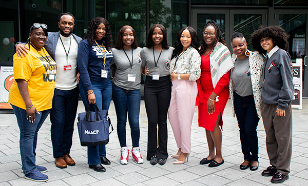 A group photo of student staff and guests at the Students of Color Symposium